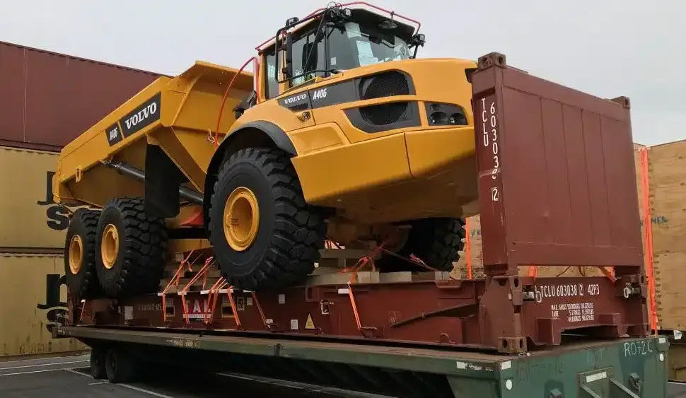 Heavy equipment secured on a flat rack container in Dubai