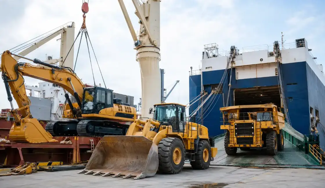 Excavators and construction equipment at the port for heavy machinery shipping from Dubai